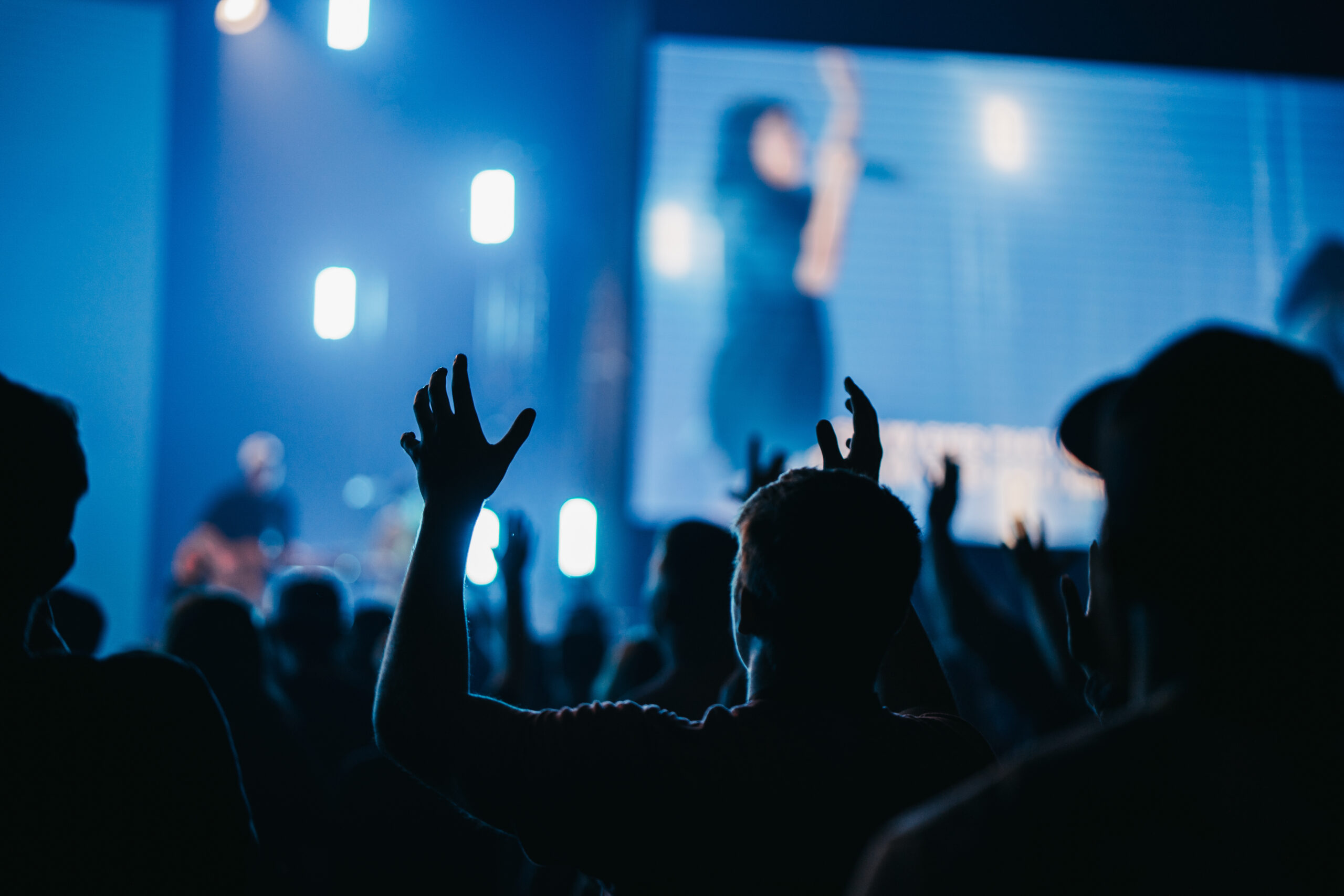 crowd of people worshiping