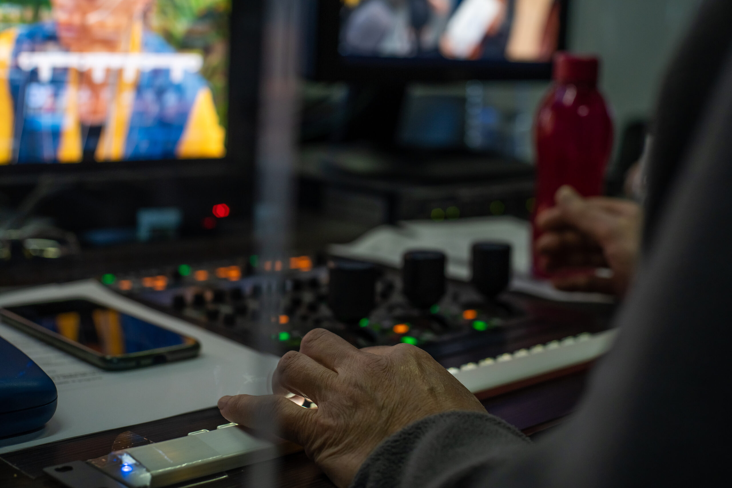 Operator operates the remote control at the TV